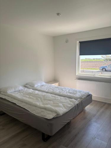 Postel nebo postele na pokoji v ubytování Glommen