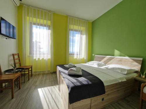 Postel nebo postele na pokoji v ubytování Fiore Hotel