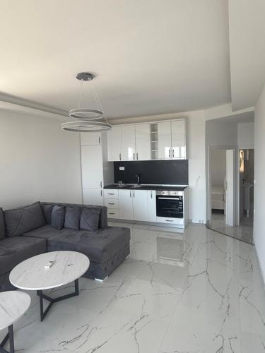 a living room with a couch and a table at Azure View in Dobra Voda