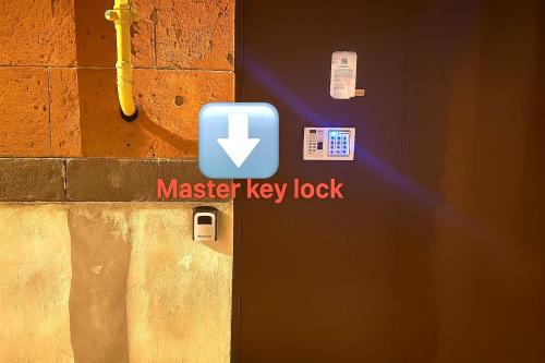 a master key lock sign on the side of a door at Cosy One bedroom Appartment with open balcony terrace, near Opera, Tumanyan & Pushkin streets, Self Check in, city centre, Yerevan in Yerevan