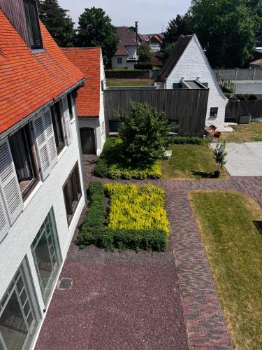 an aerial view of a garden in a house at The Cotton Suites B&B in Deerlijk