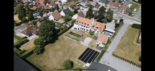 an aerial view of a house with a solar panel at The Cotton Suites B&B in Deerlijk
