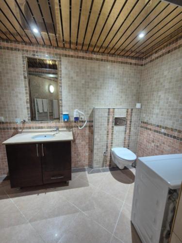 Koupelna v ubytování Dinara Apart Hotel