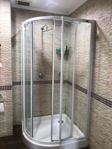 a shower with a glass enclosure in a bathroom at Large beachfront apartment in Cha-am in Ban Bo Khaem