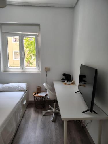 TV a/nebo společenská místnost v ubytování Agui House