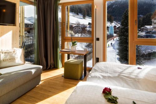 Postel nebo postele na pokoji v ubytování Mountain Design Hotel EdenSelva