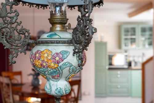 a vase with a flower design on a table at Munnik's Hof in Amsterdam