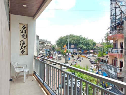 a balcony with a view of a busy city street at Prime Residency in Kolhapur
