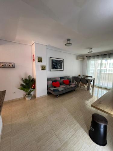 a living room with a couch and a table at Costa Marina III - Vistas inmejorables in El Borseral