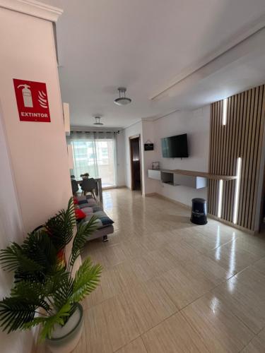 a living room with a couch and a tv at Costa Marina III - Vistas inmejorables in El Borseral