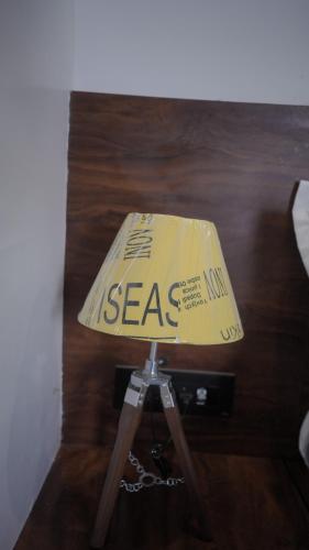 a table lamp with a box on top of it at Hotel Aana Inn Prime Swiming Pool in Jaipur