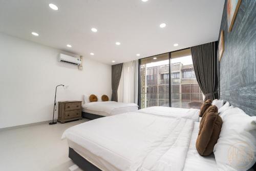Katil atau katil-katil dalam bilik di KN Holiday Home in Global City