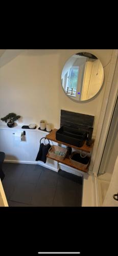 a small room with a mirror and a table at Step back in time in Rye