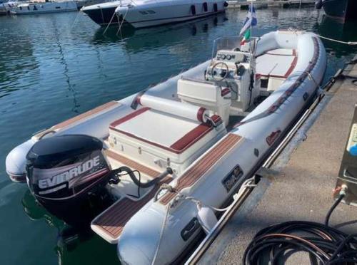 a boat is docked at a dock in the water at PiazzaItaliaSuite appartamento con terrazza in Cagliari