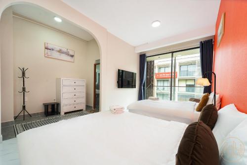 Katil atau katil-katil dalam bilik di KN Holiday Home in Global City