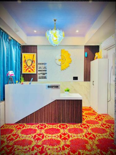a lobby with a reception desk and a red carpet at Hotel Aana Inn Prime Swiming Pool in Jaipur
