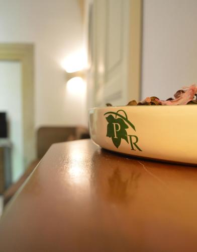 a bowl of food sitting on top of a table at Palazzo Rollo in Lecce