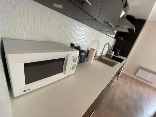 Kuchyň nebo kuchyňský kout v ubytování Raunex Apartment