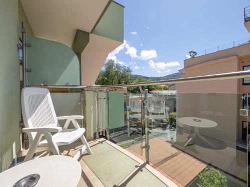 a balcony with two chairs and a table at Hotel Gardenia Sorrento, Ascend Hotel Collection in Sorrento