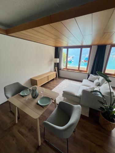 a living room with a couch and a table at Apartment 18 am Brienzersee in Brienz