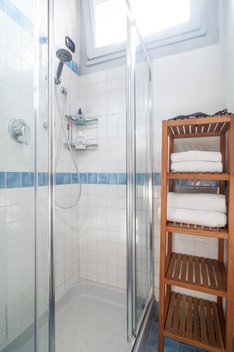a bathroom with a shower with a glass door at TAKE OFF Airport House in Orio al Serio