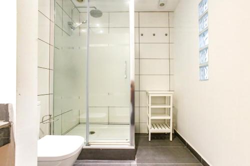 a bathroom with a shower and a toilet at Tranquil large 6 bedroom family Villa sleeps 20 near sitges in Sant Pere de Ribes
