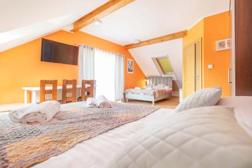 a bedroom with a large bed with towels on it at Turkus in Międzywodzie