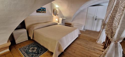a bedroom with a bed in a room at La casa del Maestro - Gallipoli - centro storico in Gallipoli