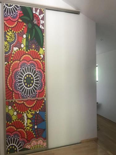 a mural on a wall in a room with a wall at Apartament z kotem in Bielsko-Biala