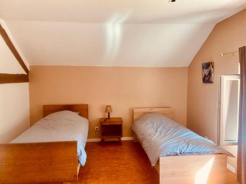 Postel nebo postele na pokoji v ubytování Chez Mymy