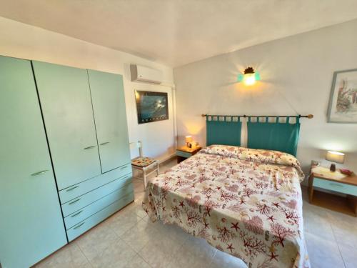 A bed or beds in a room at Appartamenti San Teodoro