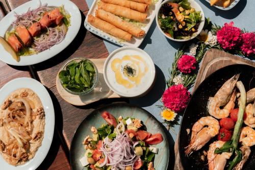 a table full of plates of food on a table at Olive Garden Kabak in Faralya