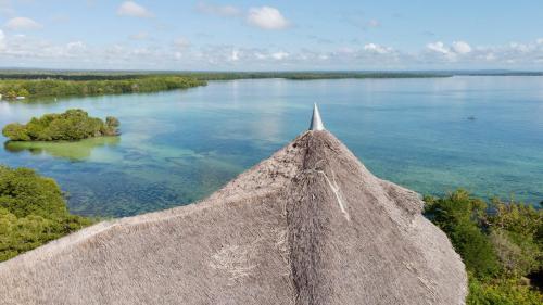 a view from the top of a stone wall overlooking a lake at Rock and Sea Resort in Watamu