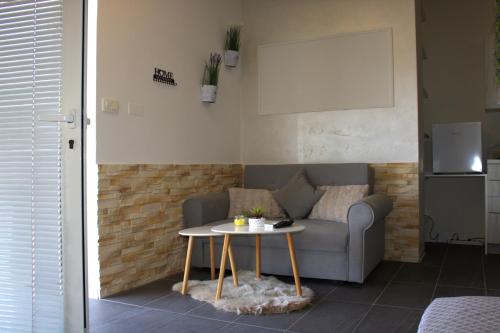 a living room with a couch and a table at Sunset in Piran