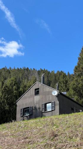 a house sitting on top of a hill at Ca' Negra, Do-Minus Design Retreat & SPA in Bellinzona