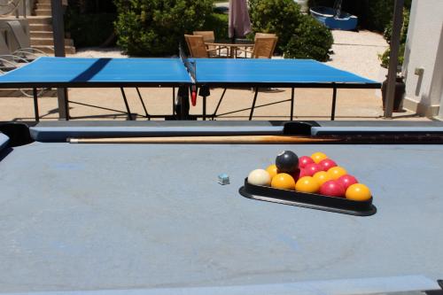 a pool table with a tray of balls on it at St.George's Country Retreat in Limassol