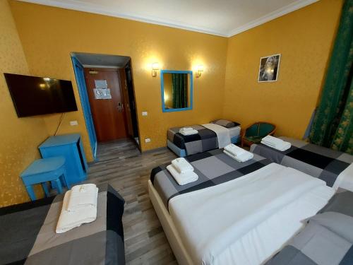 Postel nebo postele na pokoji v ubytování Hotel Positano 2 MIMOSA