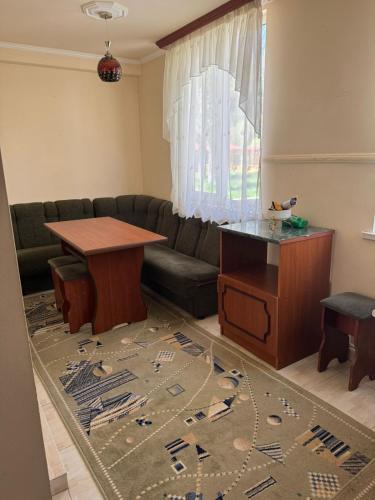 a living room with a couch and a table at Apartment in Jermuk, ARMENIA in Jermuk