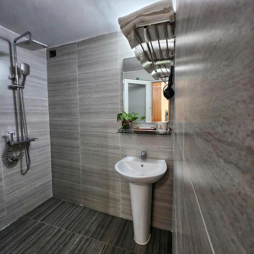 a bathroom with a sink and a mirror at TaHien Loft in Hanoi