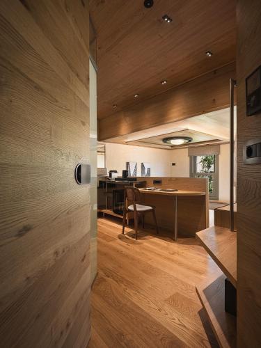 an open kitchen and dining room with wood walls at Elysia Boutique Hotel in Chania Town