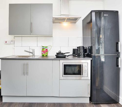 Η κουζίνα ή μικρή κουζίνα στο London E14 Poplar - Cosy 1 Bed Apartment for 3