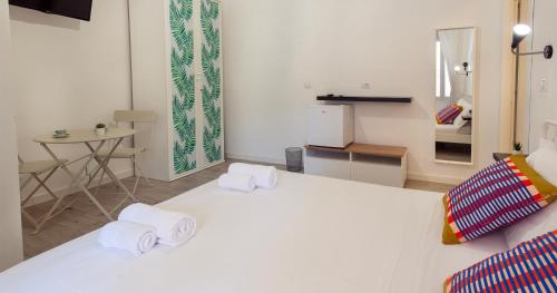 Postel nebo postele na pokoji v ubytování Le Pigne - Mare e Relax