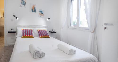 Postel nebo postele na pokoji v ubytování Le Pigne - Mare e Relax