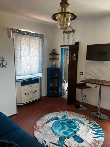 a living room with a rug on the floor at I cavallucci marini in Lerici