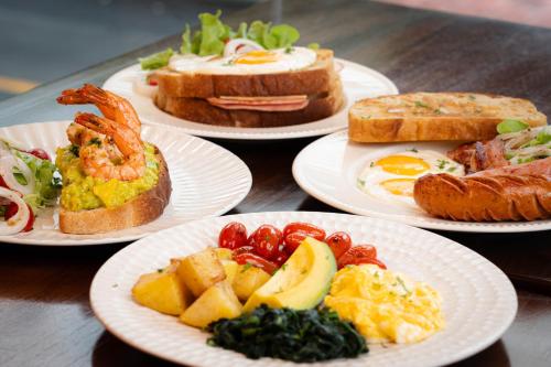 a group of plates of food on a table at Baan K Residence in Bangkok