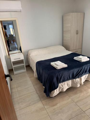 Ένα ή περισσότερα κρεβάτια σε δωμάτιο στο Apart Rocamora