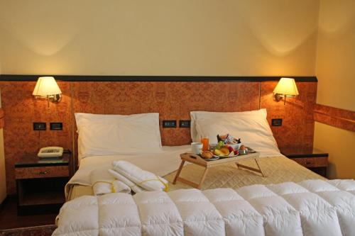 Lova arba lovos apgyvendinimo įstaigoje Park Hotel Villa Leon d'Oro