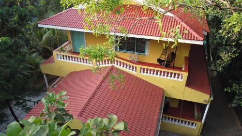 an aerial view of a house with a red roof at Independent Villa with private pool in Siolim Goa in Oxel