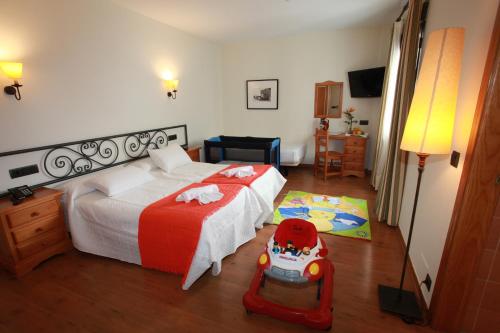 Tempat tidur dalam kamar di Hotel La Bodega