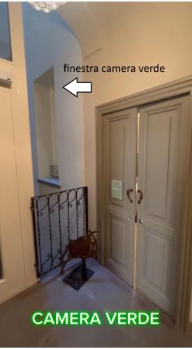 a picture of a room with a door and a chair at Borgo35 in Parma